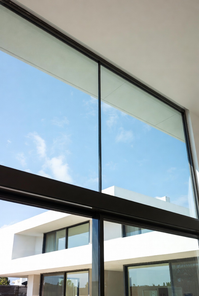 Motorized guillotine window